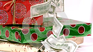 Cash falling on christmas gifts