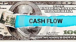 Cash Flow Finance. The word Cash Flow in the background of the US dollar. Money Flowing through a Business Pipeline