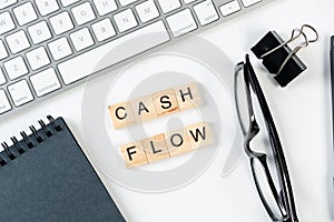 Cash flow statement concept with letters on cubes