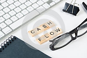 Cash flow statement concept with letters on cubes