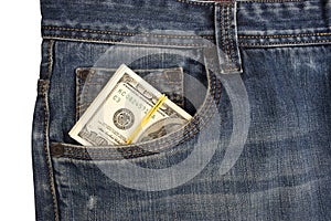 Cash in the front pocket of blue jeans closeup