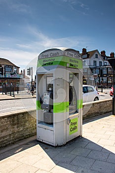 Cash machine and public phone box in the town centre of Skegness in the UK