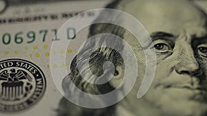 Cash money background. Benjamin Franklin portrait on 100 US dollar bill close up, the image is rotated