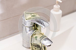 Cash Money Going Down Sink Drain Isolated on White Background