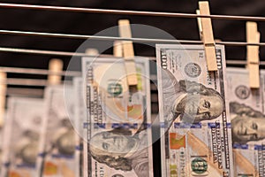 Cash Money laundering on clothesline. Money Laundering US dollars hung out to dry.