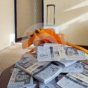 Cash prize, Stacks of Saudi Riyal banknotes on a table