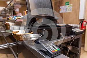 Cash register for paying for purchases in a cafe with a digital terminal