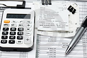 Cash registers purchase receipt, calculator and financial reports, analysis and accounting, various office items for bookkeeping photo