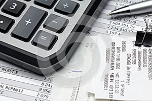 Cash registers purchase receipt written on russian language, calculator and financial reports, analysis and accounting, various photo