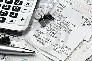 Cash registers purchase receipt written on russian language, calculator and financial reports, analysis and accounting, various photo