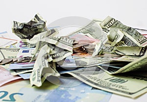 Cash on table isolated: dollars, euro, rubl broken money. All in mess, global crisis concept