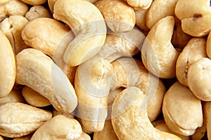 Cashew nut heap food texture background, macro shot. Nutritious nutty morsels