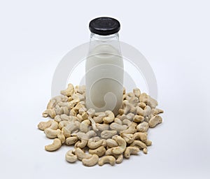Cashew nut milk in bottle on isolated background photo
