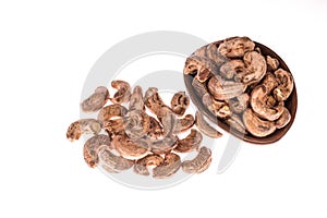 Cashew nuts in bowl on white background