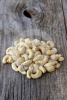 Cashew nuts. Cashew on wood background. Close up