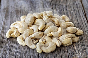Cashew nuts. Cashew on wood background. Close up