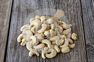 Cashew nuts. Cashew on wood background. Close up