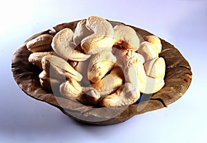 Cashew nuts in a natural leaf bowl