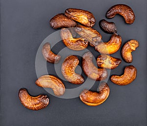 The cashew nuts are roasted until burnt overcooked to a black, dark brown flavor, too bitter and hard to eat