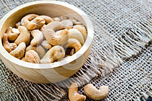 Cashew nuts salted and roasted in wooden bowl