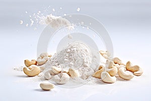 A pile of cashew salt and cashew nuts on a white background