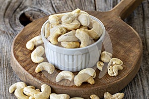 Cashew nuts on wood background. Bulk Cashews