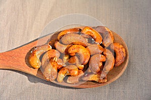 Cashew on wooden feed is sacked background.