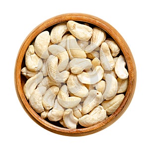 Cashew nuts, raw cashews, seeds of shelled fruits, in a wooden bowl photo