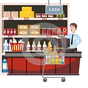 Cashier behind the cashier counter in the interior supermarket, shop, store, shelves food products, goods. Grocery cart