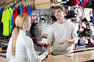 cashier helping customer at the pay desk