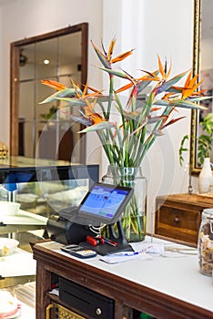 Cashier machine and computer in a Vietnamese coffee shop