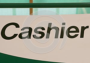 Cashier sign indoors, indicating location to pay