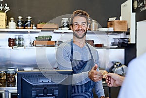 Cashier, smile and credit card for payment, financial transaction and service in coffee shop. Barista or server and