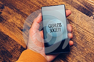 Cashless society concept, man using smartphone for electronic pa photo