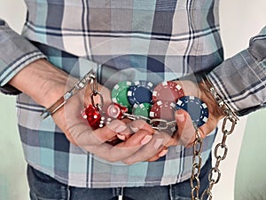 Casino chips dice and persons in handcuffs