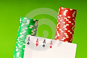 Casino chips and four aces