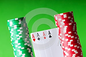 Casino chips and four aces