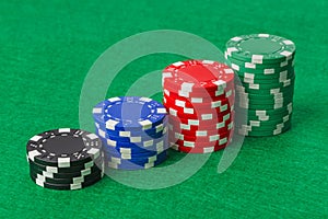 Casino chips on green table