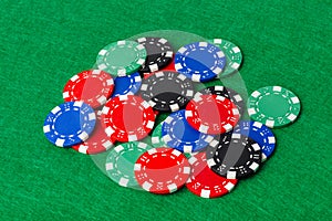 Casino chips on green table