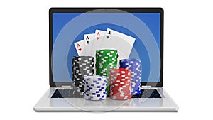 Casino chips and playing cards on laptop, online casino concept. Gambling chips poker cards money on laptop computer.