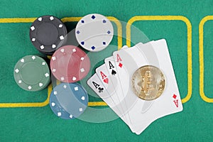 Casino chips winning combination four aces, golden bitcoin