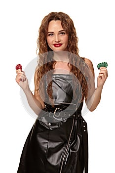Casino concept. Portrait of young pretty caucasian woman, playing in casino. Roulette, poker chips, cards, wheel