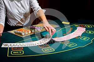 Casino: Dealer shuffles the poker cards