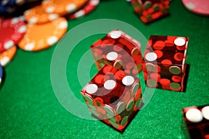 Casino dices on a green mat
