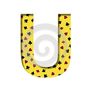 Casino font. The letter U cut out of paper on the yellow background of the pattern of card suits spades hearts diamonds and clubs