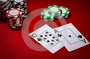 Casino gambling and gaming industry concept with cards making a blackjack surrounded by chips and a 3 to 2 payout in dim lights