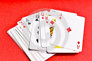 Playing card ACe Heart Jack Queen King on Textured Red Background
