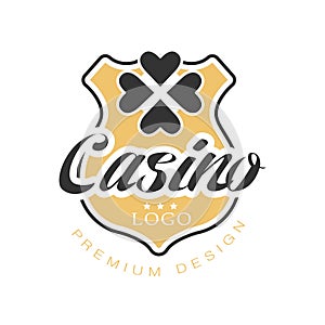 Casino logo premium design, vintage gambling badge or emblem with golden shield and clover leaf vector Illustration