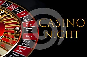 Casino night poster and gambling on games of chance concept with the ball in the winning number seventeen on a roulette wheel photo