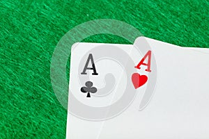 Casino playing cards on green table